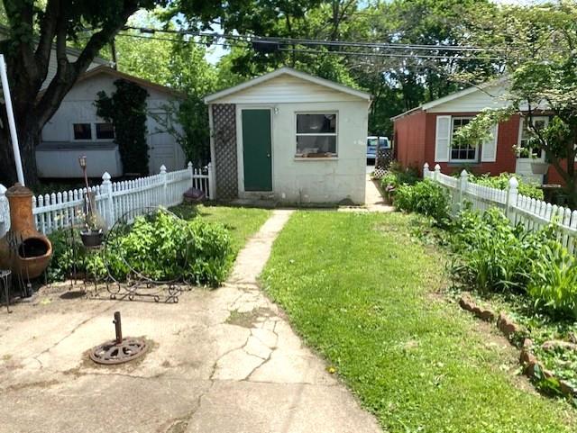 842 Chestnut Street Emmaus, PA 18049 - Photo 10 of 13 A classic white picket fence encloses a verdant yard with mature trees and a charming storage shed.