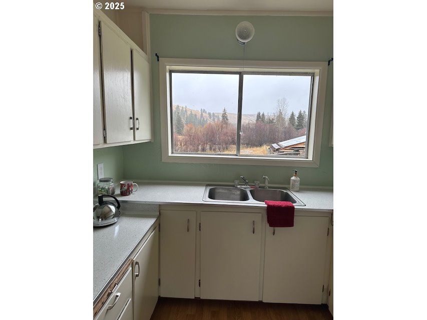 62254 Wallowa Mtn Loop Road Joseph, OR 97846 - Photo 34 of 35 a bathroom with a sink and mirror