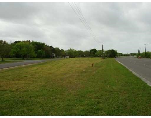 0 Port Avenue Ingleside, TX 78362 - Photo 2 of 2 a view of a lake with houses in the background