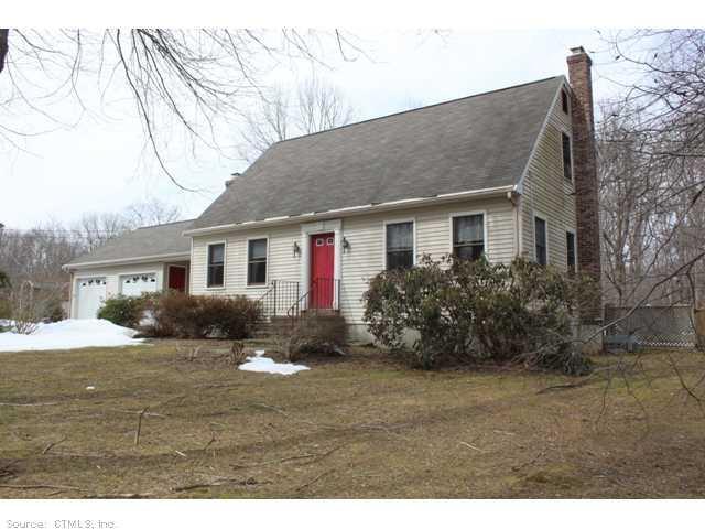 57 O'Connell Road Colchester, CT 06415 - Photo 1 of 1 a backyard of a house with potted plants and large tree