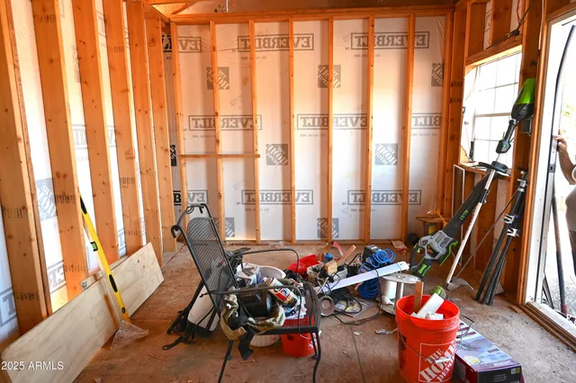 a view of a room with lots of furniture and floor to ceiling windows