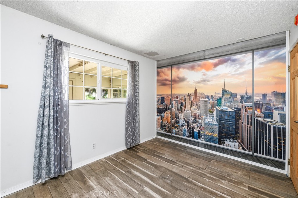 2490 Invar Court Simi Valley, CA 93065 - Photo 13 of 25 a view of a room with wooden floor and a window