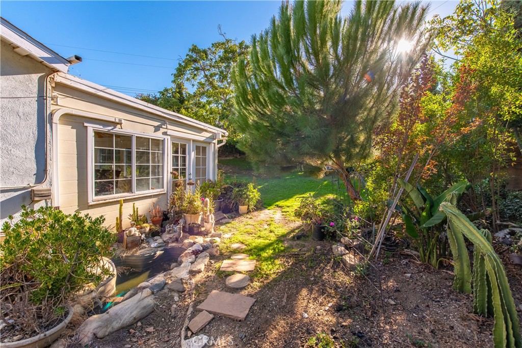 2490 Invar Court Simi Valley, CA 93065 - Photo 23 of 25 a front view of a house with a yard