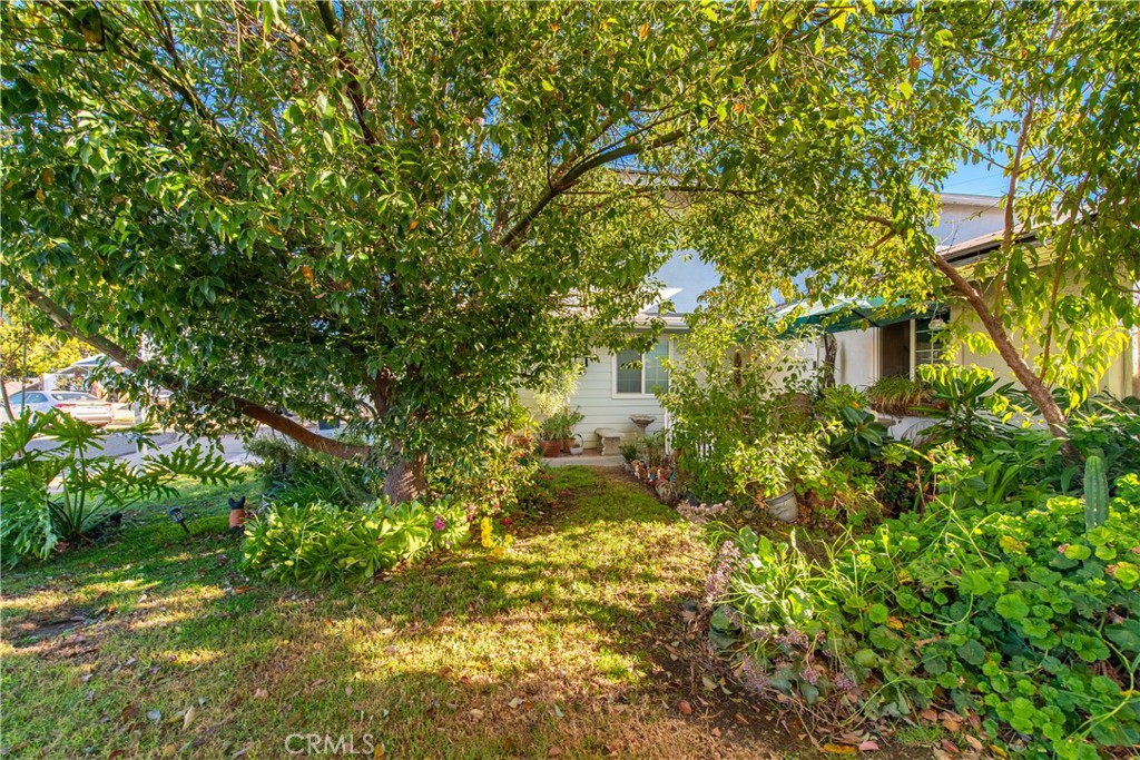 2490 Invar Court Simi Valley, CA 93065 - Photo 24 of 25 a backyard of a house with lots of green space and garden