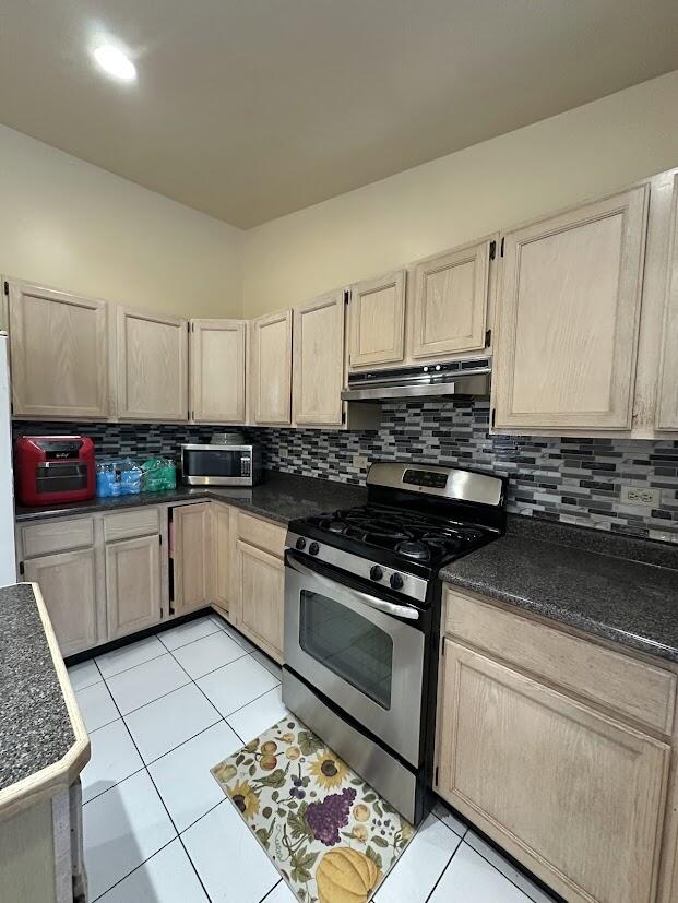 1518 West 96th Place Crown Point, IN 46307 - Photo 12 of 37 a kitchen with stainless steel appliances granite countertop a stove a sink and a microwave