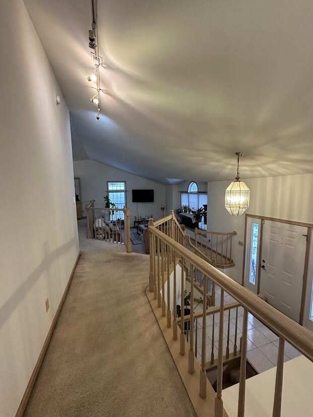 1518 West 96th Place Crown Point, IN 46307 - Photo 20 of 37 a view of a hallway with furniture and chandelier