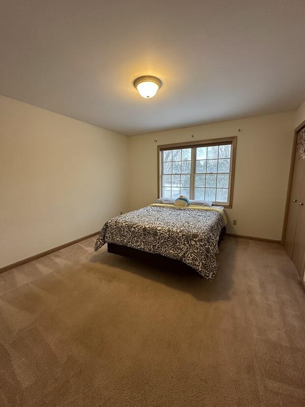 1518 West 96th Place Crown Point, IN 46307 - Photo 25 of 37 a bedroom with a bed and a window