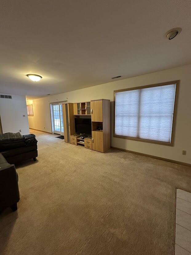1518 West 96th Place Crown Point, IN 46307 - Photo 29 of 37 a living room with furniture and a flat screen tv