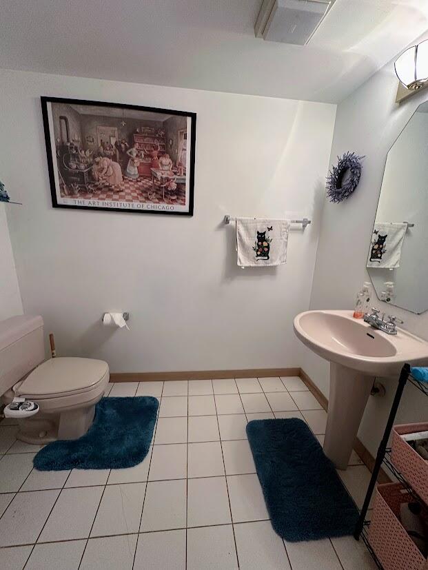 1518 West 96th Place Crown Point, IN 46307 - Photo 34 of 37 a bathroom with a toilet a sink and mirror