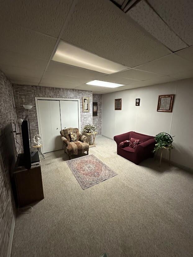 1518 West 96th Place Crown Point, IN 46307 - Photo 36 of 37 a living room with furniture gym equipment and a flat screen tv