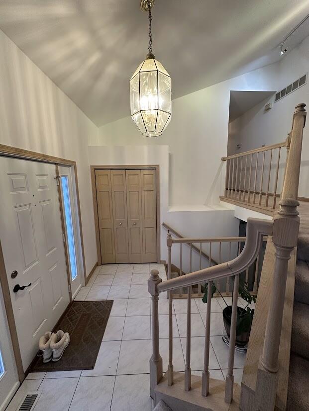 1518 West 96th Place Crown Point, IN 46307 - Photo 5 of 37 a view of a hallway with furniture and a chandelier
