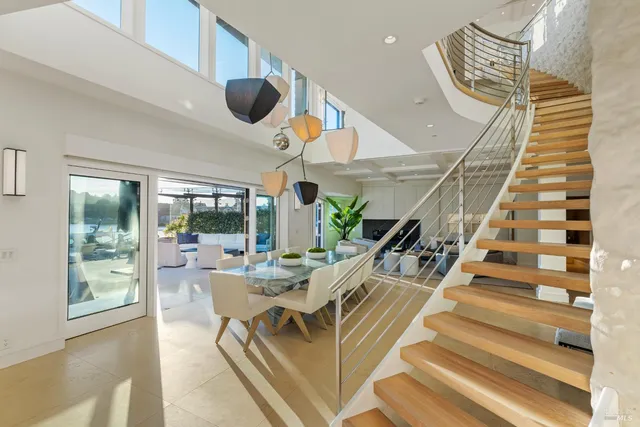 a view of a dining room with furniture wooden floor and chandelier