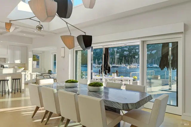 a kitchen with stainless steel appliances kitchen island granite countertop a stove and cabinets