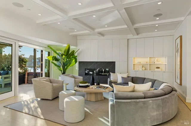 a large kitchen with stainless steel appliances kitchen island granite countertop a lot of counter space and a sink