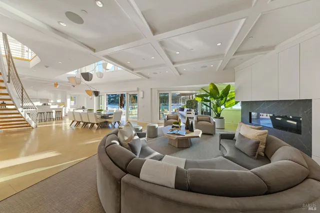 a bedroom with bed and glass windows