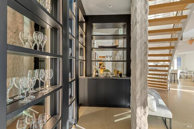 a bedroom with a large bed and a large window with outer view