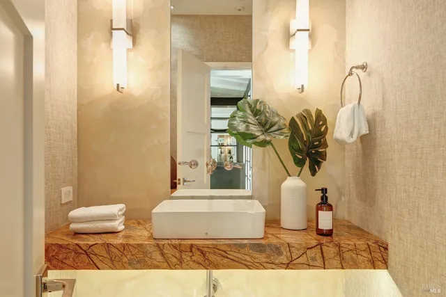 a view of a patio with a table and chairs