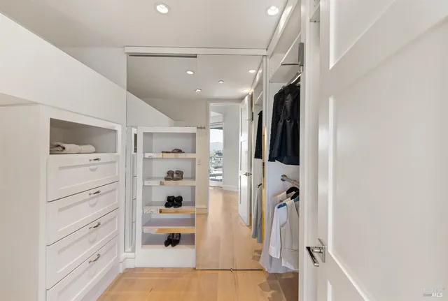 a view of a chairs and table in a balcony