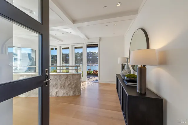 a view of a dining room with furniture wooden floor and chandelier