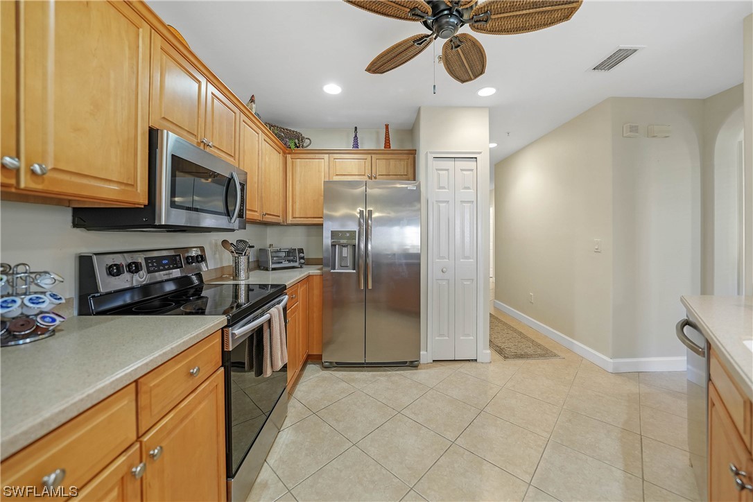 3228 Sunset Key Circle, Unit 101 Punta Gorda, FL 33955 - Photo 13 of 33 a kitchen with stainless steel appliances granite countertop a refrigerator a stove and a sink