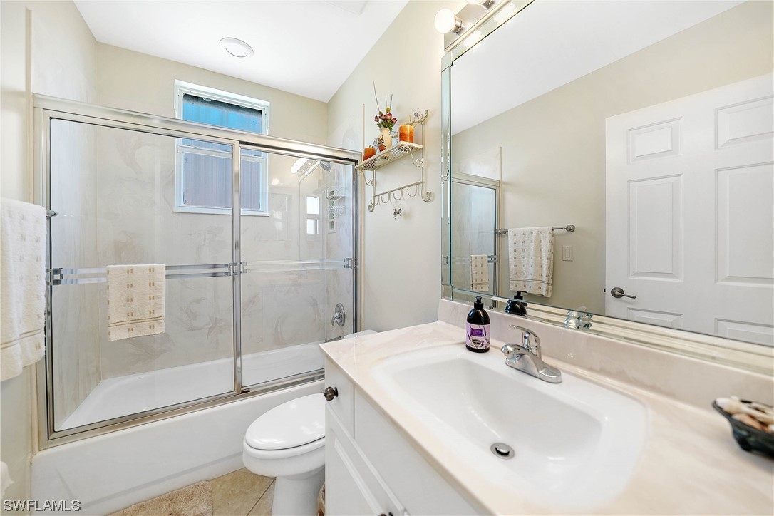 3228 Sunset Key Circle, Unit 101 Punta Gorda, FL 33955 - Photo 24 of 33 a bathroom with a sink toilet and shower