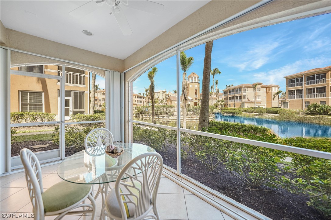 3228 Sunset Key Circle, Unit 101 Punta Gorda, FL 33955 - Photo 6 of 33 a view of a porch with furniture and floor to ceiling windows