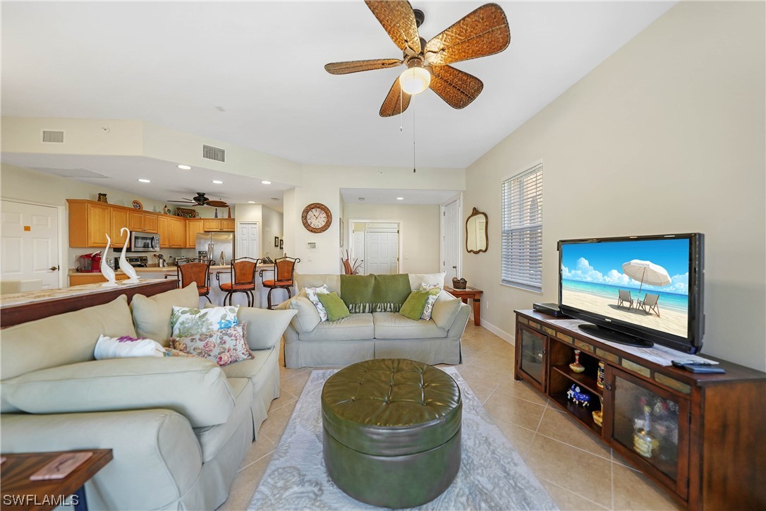 3228 Sunset Key Circle, Unit 101 Punta Gorda, FL 33955 - Photo 8 of 33 a living room with furniture and a flat screen tv