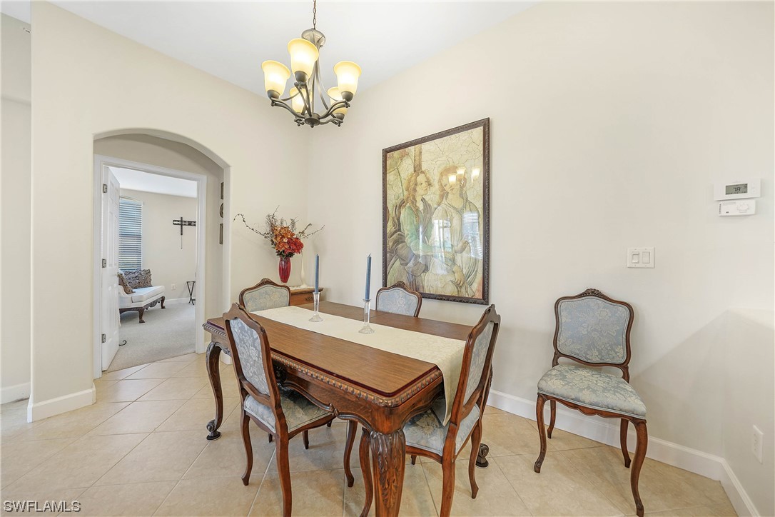3228 Sunset Key Circle, Unit 101 Punta Gorda, FL 33955 - Photo 10 of 33 a dining room with furniture and chandelier