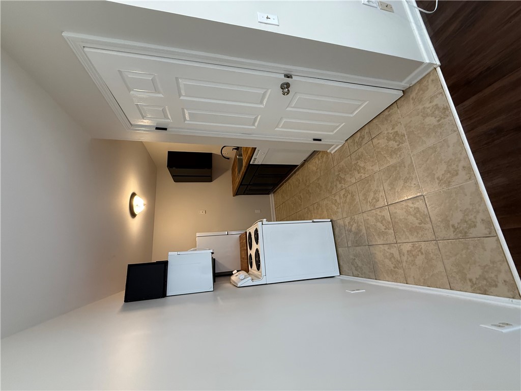 125 Maple Street, Unit 110 Pendleton, SC 29670 - Photo 5 of 18 A kitchen with durable tile flooring and accessible storage options. The washer and dryer are tucked in the closet!