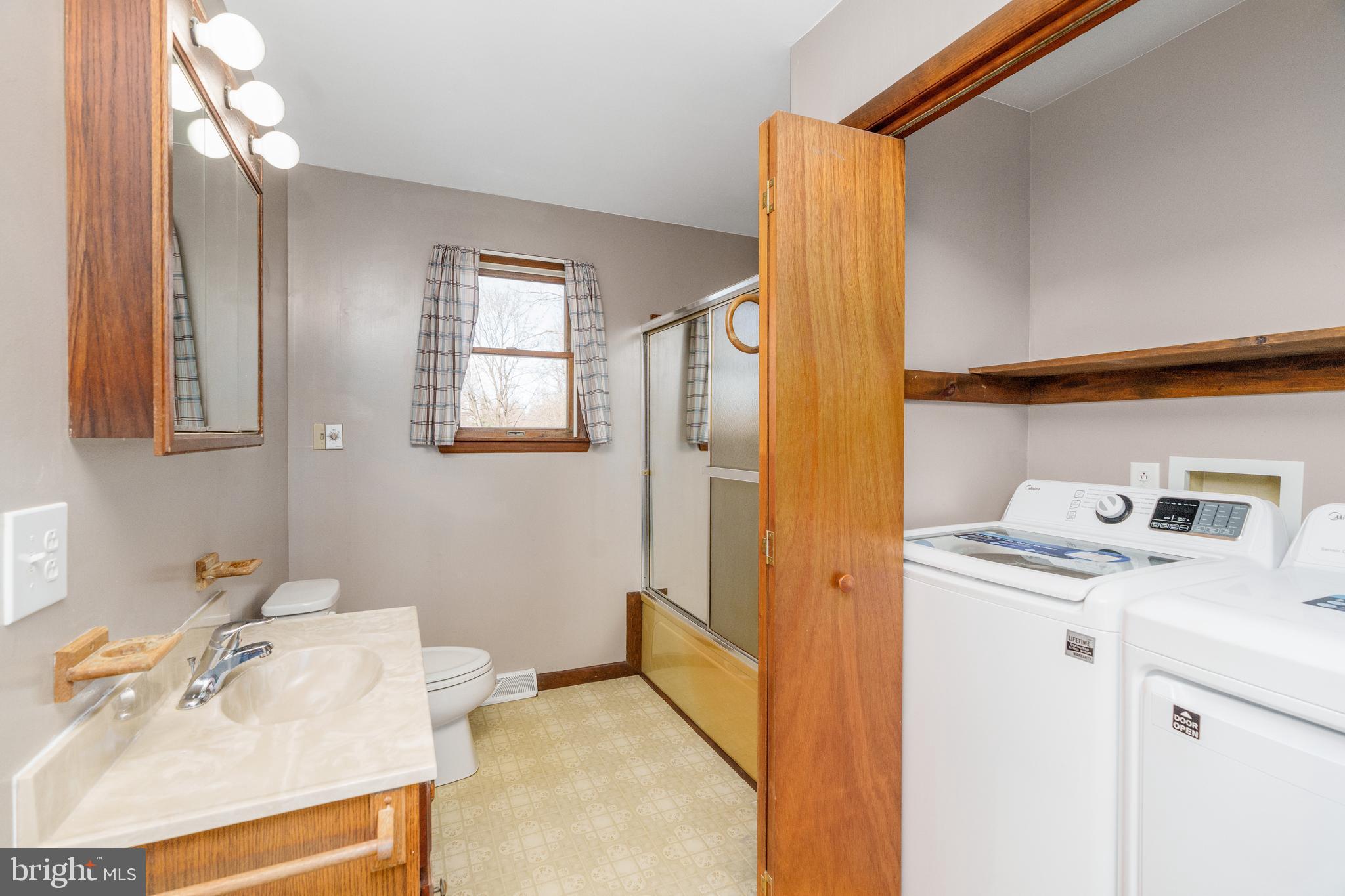 411 New Bridge Road Rising Sun, MD 21911 - Photo 9 of 15 Full bathroom with washer and dryer