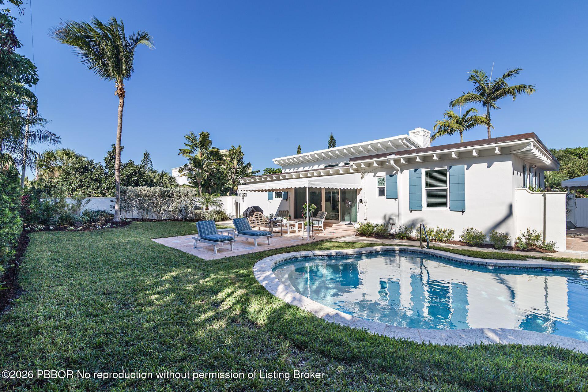 224 Churchill Road West Palm Beach, FL 33405 - Photo 21 of 33 a view of a house with swimming pool and sitting area