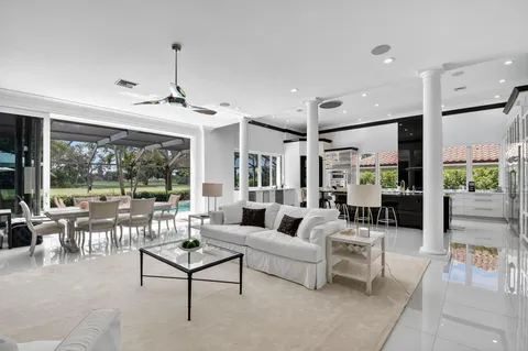 a view of a dining room with furniture wooden floor and chandelier