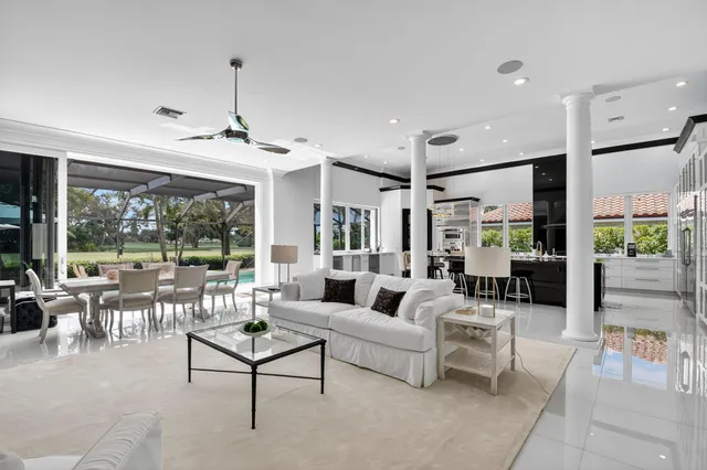 a view of a dining room with furniture wooden floor and chandelier