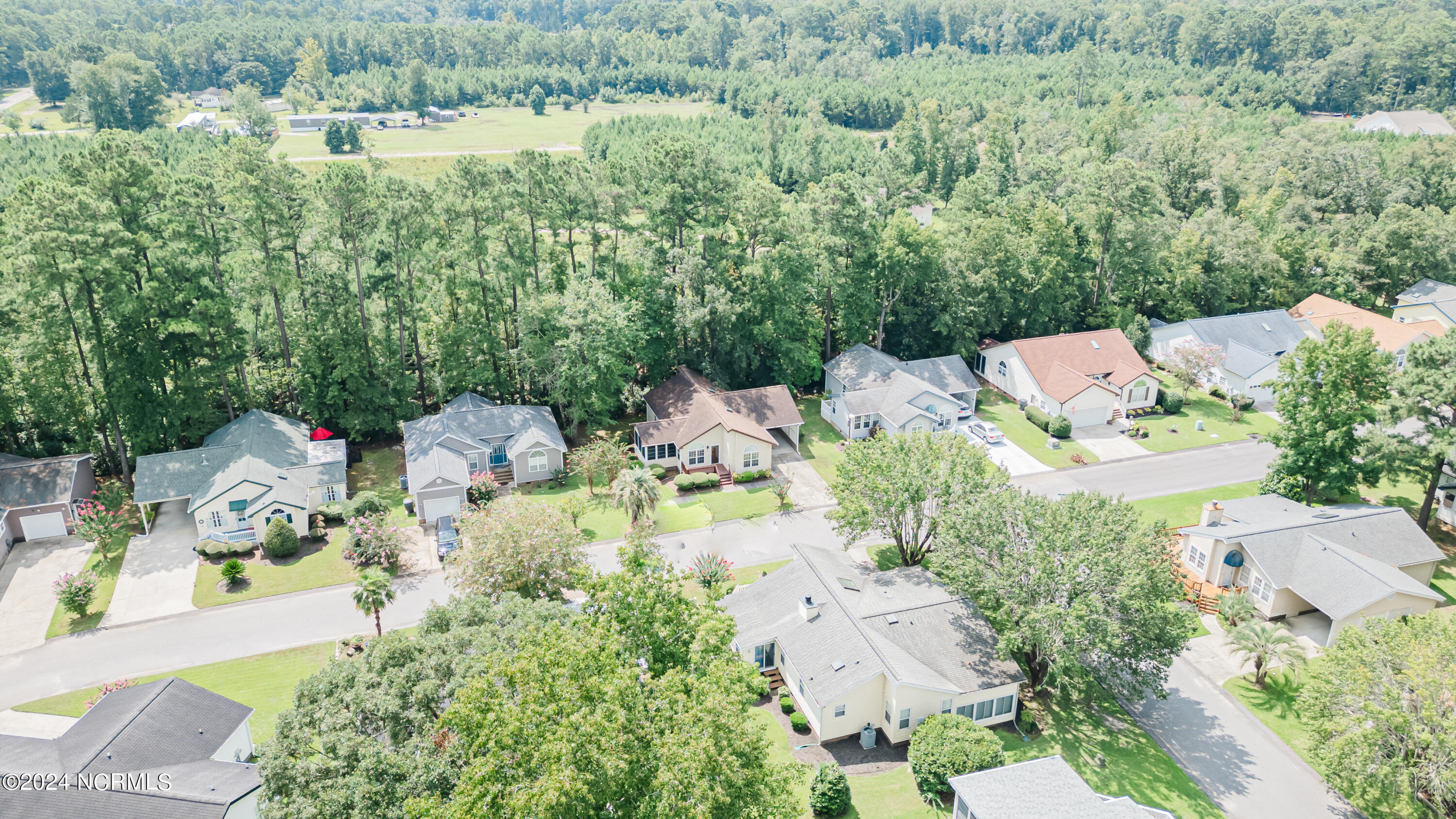 417 Deer Path Calabash, NC 28467 - Photo 26 of 32 Looking back towards 417 Deer Path. This property is minutes from downtown Calabash, with restaurants and shopping and a short drive to the local South Brunswick Island beaches and entertainment.