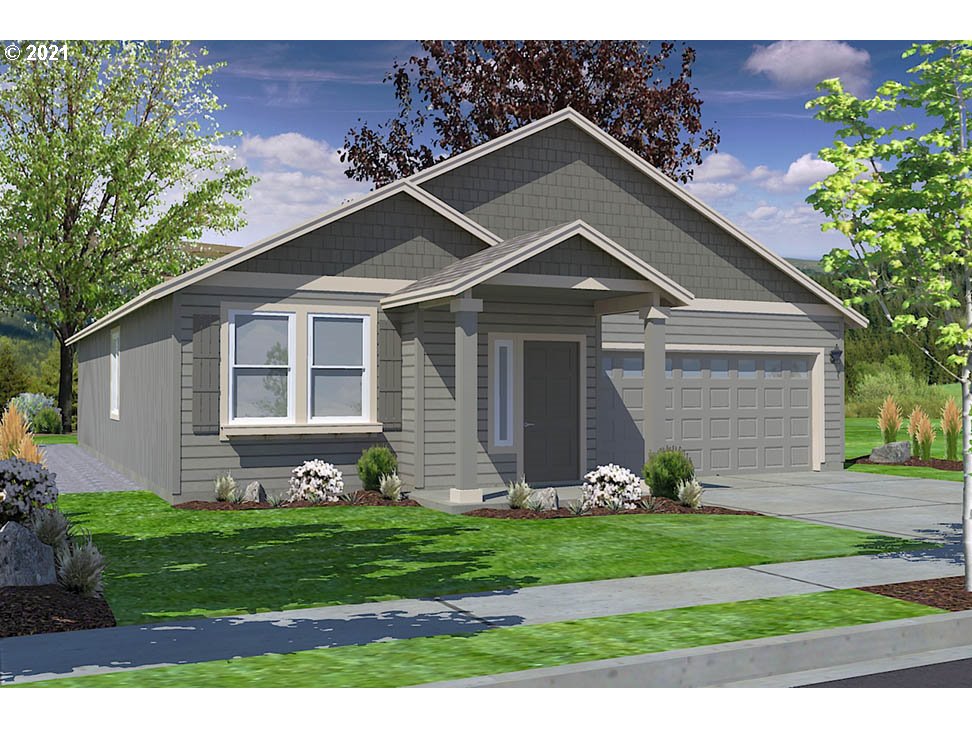 5150 Squirrel Street Springfield, OR 97478 - Photo 1 of 13 a front view of a house with a garden and plants