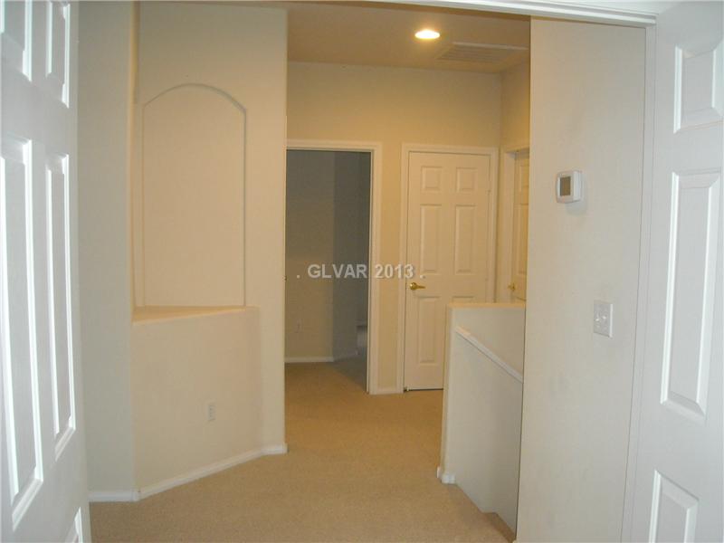 275 Reflection Ridge Court Henderson, NV 89052 - Photo 13 of 18 Property Photo. Hallway leading to jack n jill bedrooms