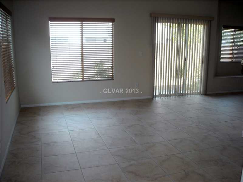 Property Photo. Nice and bright living room w/ceramic tile