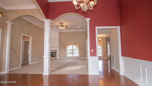 wooden floor in an empty room with a mirror