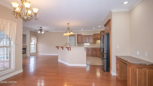 a view of a kitchen and a chandelier