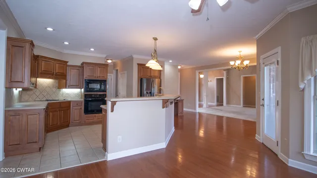 a view of a kitchen and dining room