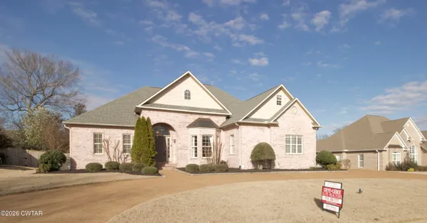 a view of a white house with a large windows