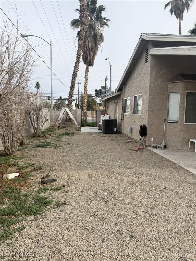5311 South Sandhill Road Las Vegas, NV 89120 - Photo 23 of 24 Fenced backyard featuring a patio and a gate