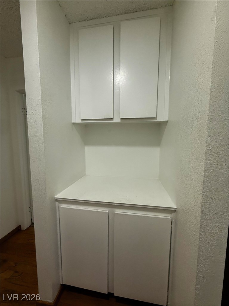 5311 South Sandhill Road Las Vegas, NV 89120 - Photo 7 of 24 Detailed view of a textured wall and wood finished floors