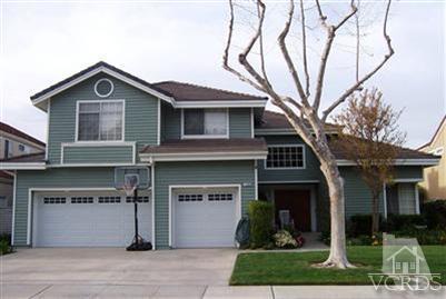 11699 Chestnut Ridge Street Moorpark, CA 93021 - Photo 1 of 20 a front view of a house with garden