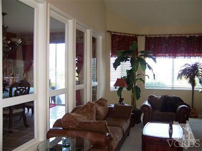 11699 Chestnut Ridge Street Moorpark, CA 93021 - Photo 11 of 20 a living room with furniture and a potted plant