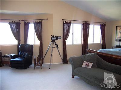 11699 Chestnut Ridge Street Moorpark, CA 93021 - Photo 13 of 20 a living room with furniture and a window