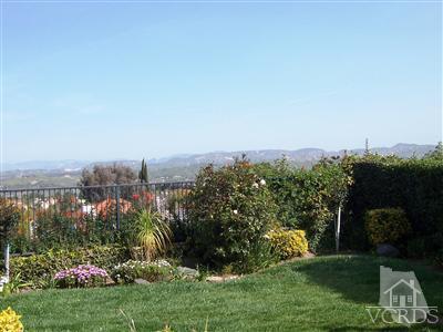 11699 Chestnut Ridge Street Moorpark, CA 93021 - Photo 20 of 20 a view of a garden with a building in the background