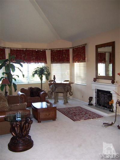 11699 Chestnut Ridge Street Moorpark, CA 93021 - Photo 3 of 20 a living room with furniture fireplace and window