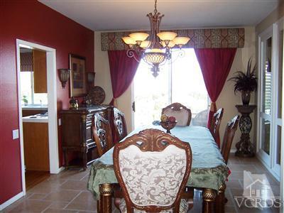 11699 Chestnut Ridge Street Moorpark, CA 93021 - Photo 5 of 20 a view of a dining room with furniture and chandelier