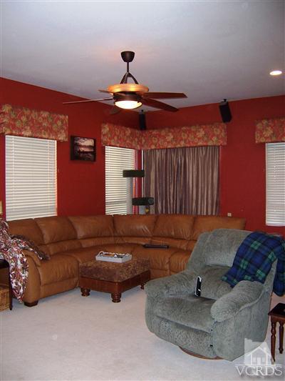 11699 Chestnut Ridge Street Moorpark, CA 93021 - Photo 6 of 20 a living room with furniture and a chandelier